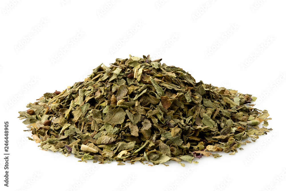 A pile of dried chopped basil isolated on white. A pile of dried chopped basil isolated on white.
