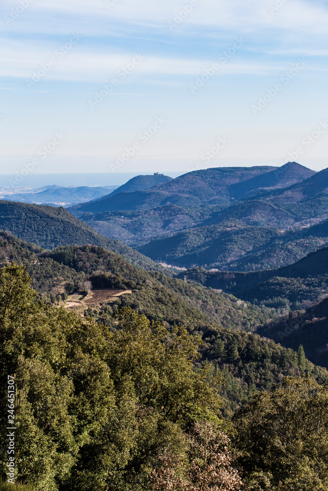 Mountain range landscape on a blue sky in Catalonian Pyrenees from a top view Mountain range landscape on a blue sky in Catalonian Pyrenees from a top view