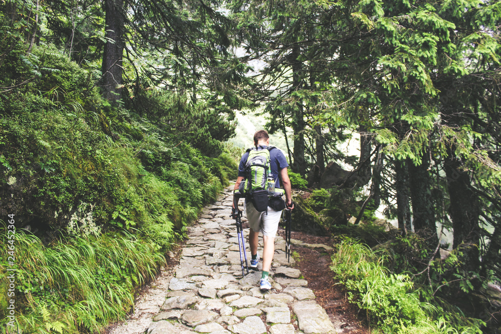 Happy hiker winning reaching life goal, success, freedom, achievement in mountains. Happy hiker winning reaching life goal, success, freedom, achievement in mountains.