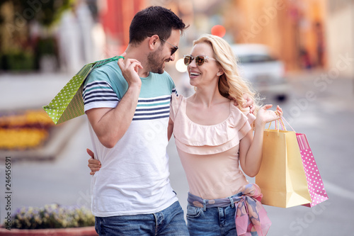Attractive couple with shopping bags