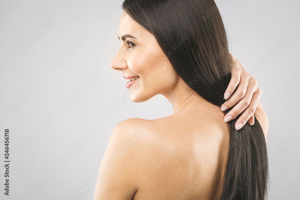 Beautiful brunette girl with long and straight brown hair. Shiny smooth and healthy well-groomed hair. Isolated over white background. Beautiful brunette girl with long and straight brown hair. Shiny smooth and healthy well-groomed hair. Isolated over white background.