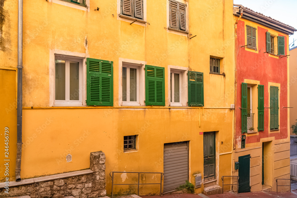 Nice, narrow street in the Vieux Nice, ancient buildings, typical facades in the old town, French Riviera