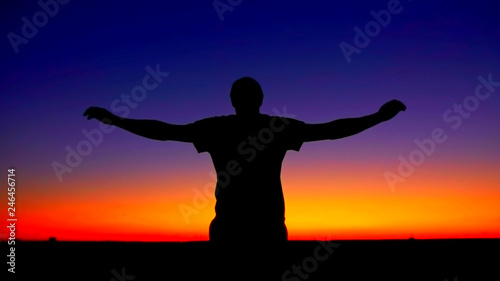 Mindful man enjoy freedom at sunset