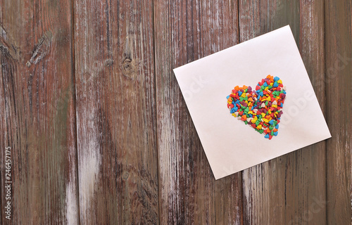 The envelope with a candy hearts. Concept Love.