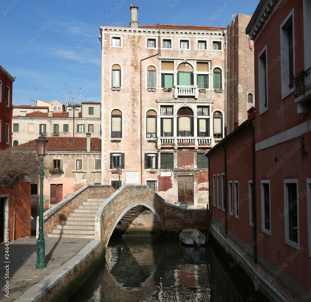 palace in Venice with the stepped bridge and the navigable canal