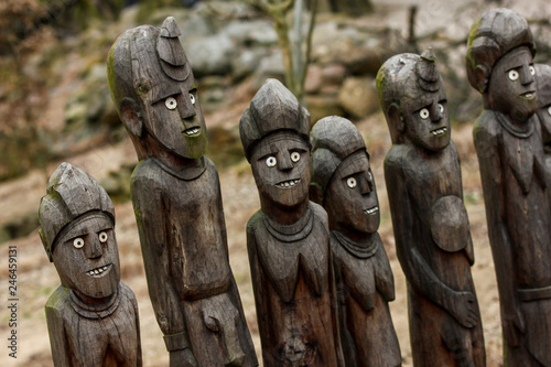 A traditional wooden African tribal statues. They look quite funny with their white eyes and teeth. 