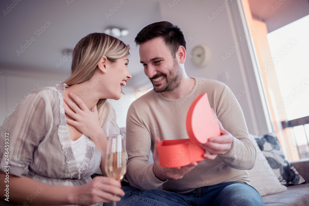 Man giving a gift to his girlfriend