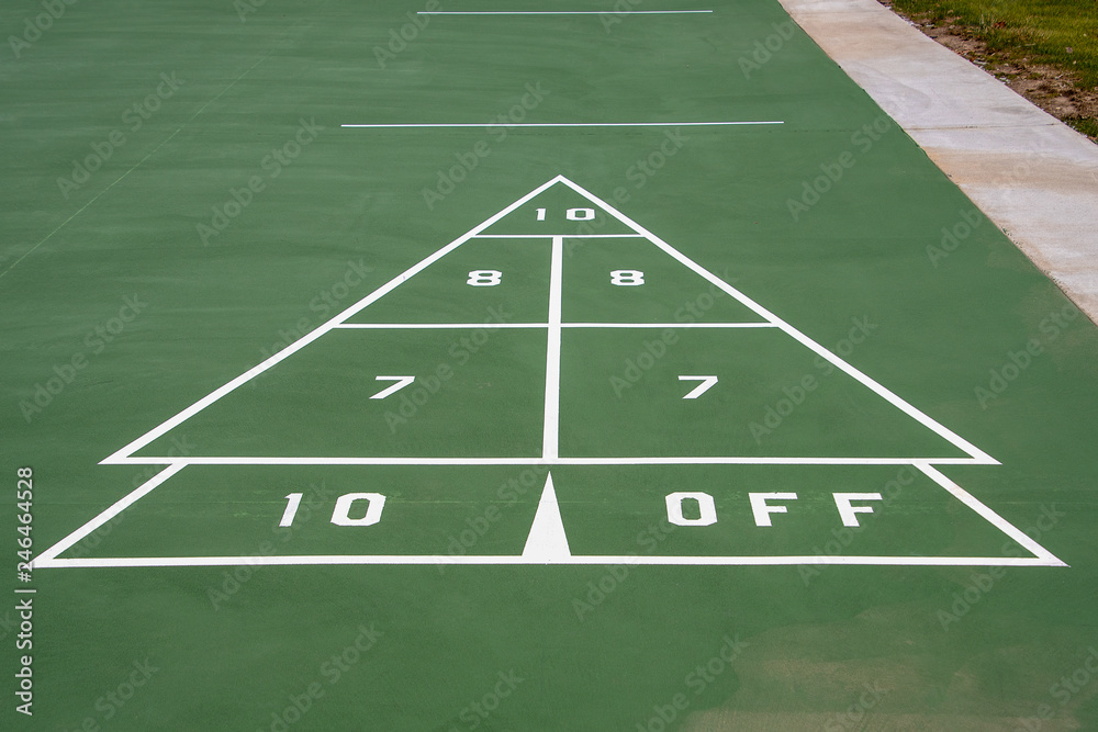 white and green painted shuffleboard game sign on pavement white and green painted shuffleboard game sign on pavement