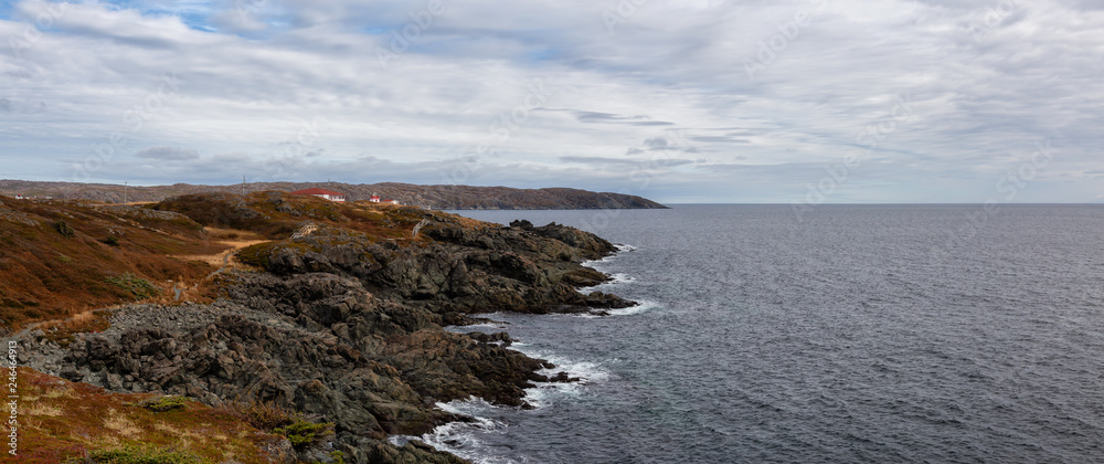 Beautiful viewpoint on the Rocky Atlantic Ocean Coast during a cloudy morning. Taken in Saint Anthony, Newfoundland, Canada.