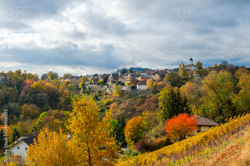 A beautiful view of the historical Aubonne village, Switzerland in a fantastic colorful autumn landscape.