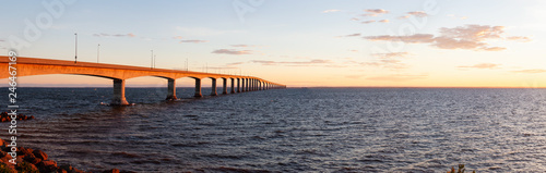 Panoramic view of Confederation Bridge to Prince Edward Island during a vibrant sunny sunrise. Taken in Cape Jourimain National Wildlife Area, New Brunswick, Canada. © edb3_16