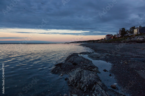 Rocky Atlantic Ocean Coast during a vibrant sunset. Taken in Rimouski, Quebec, Canada.