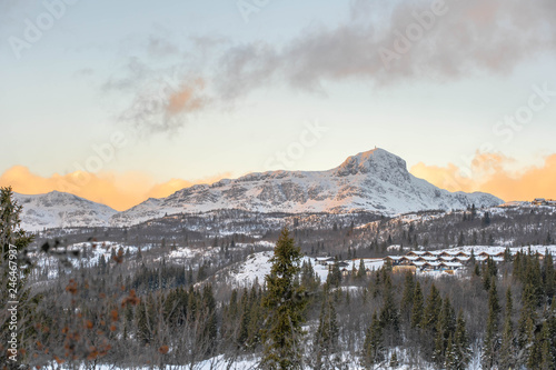 Bitihorn mountain in Norway vew from Beitostølen at sunset in winter with a lot of snow. photo