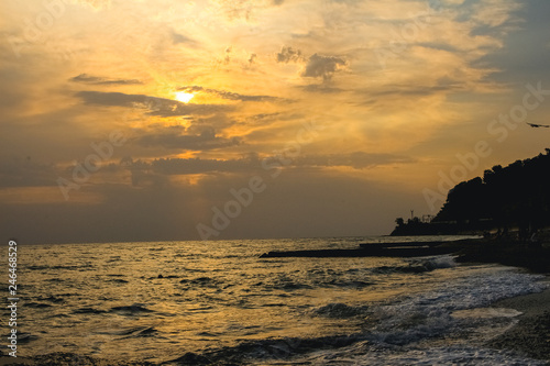 Yellow sunset on the sea coast © Vera