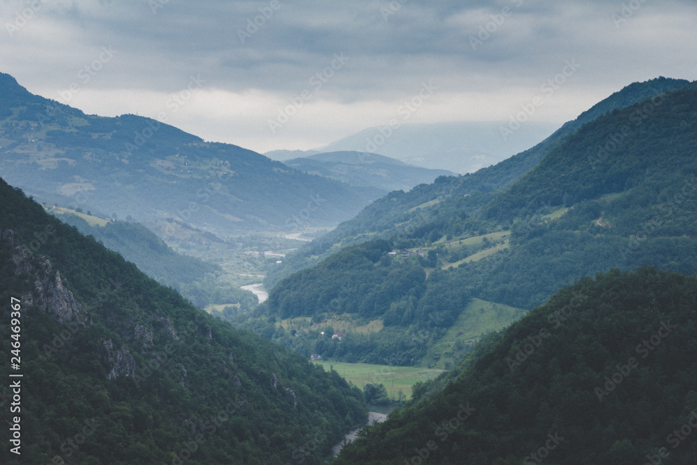 View of the mountains and canyon of the river Tara, located in the National Park of Durmitor. Montenegro. Grand canyon of Europe.Top tourist attraction in Europe. Retro vintage style. View of the mountains and canyon of the river Tara, located in the National Park of Durmitor. Montenegro. Grand canyon of Europe.Top tourist attraction in Europe. Retro vintage style.