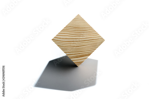 Abstract geometric real wooden cube isolated on white background with real shadow and it s not 3D render. Wooden cube on corner.