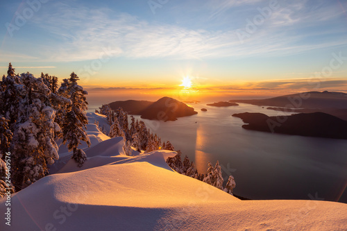 Beautiful Canadian Landscape view during a colorful winter sunset. Taken from top of Mnt Harvey, North of Vancouver, BC, Canada.