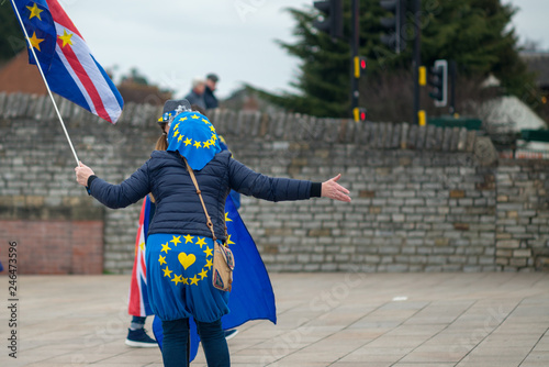 two women having heated debate or argument in the street about leaving or remaining and Brexit