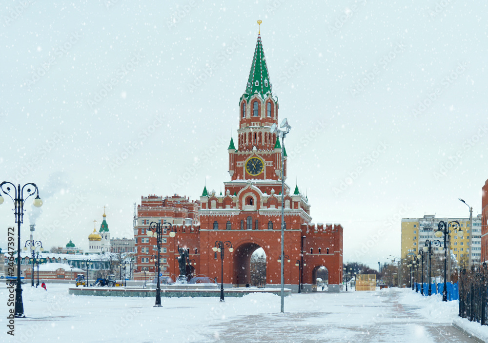 Obraz premium winter urban landscape with snow from buildings and Orthodox Church