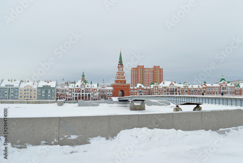 winter urban landscape with snow from buildings and Orthodox Church