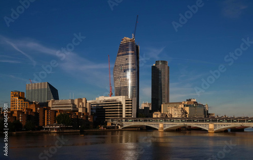 The view of London s city hall and modern skyscrapers .