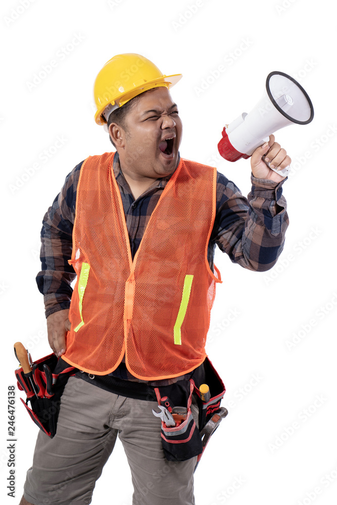 constructor standing with hand on the waist and screaming with a horn constructor standing with hand on the waist and screaming with a horn