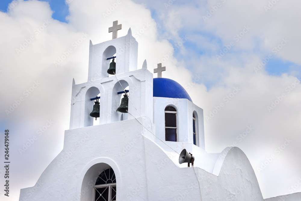 greek orthodox church domes  against the blue sky background and white clouds