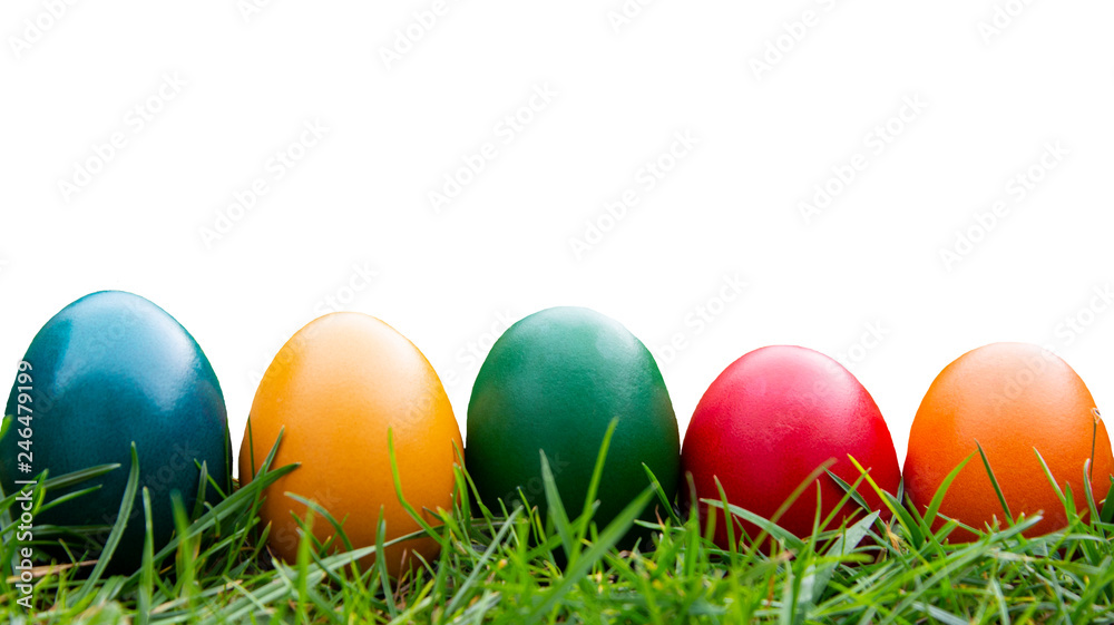 Easter background. Colorful eggs and green grass isolated. White background for copy space. Easter background. Colorful eggs and green grass isolated. White background for copy space.