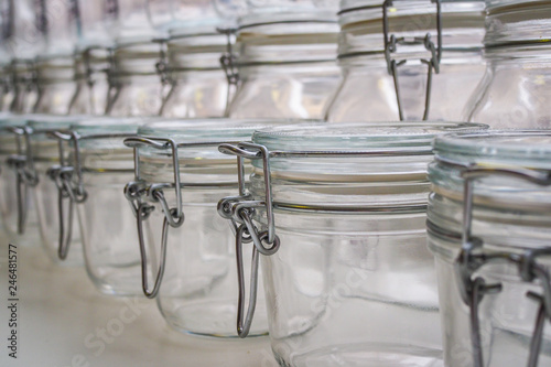 Several empty glass jars with lip-top closures in a zero waste shop