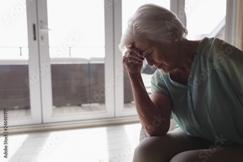 Worried senior woman sitting in living room © WavebreakMediaMicro
