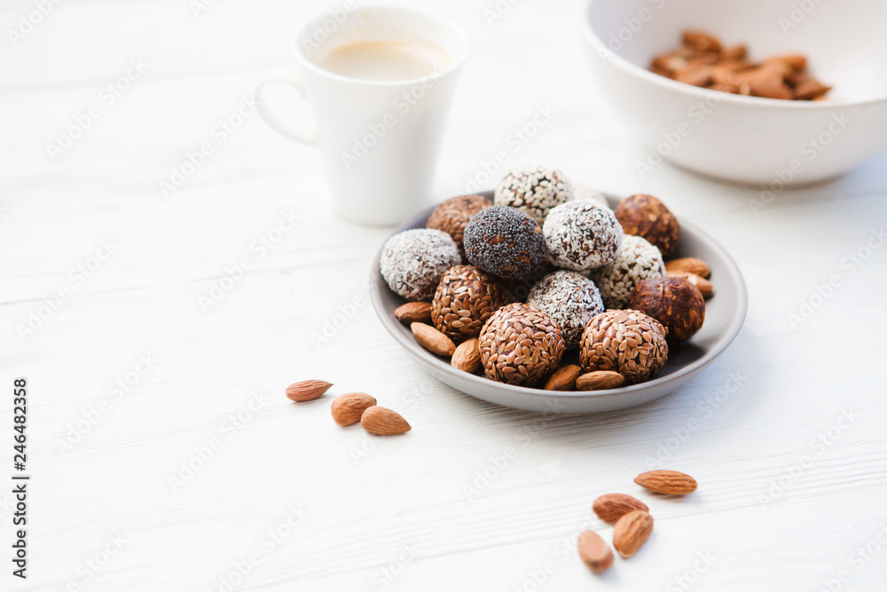 the vegan of handmade candy and ingredients on a wooden background. Fitness sweets. candies without sugar. vegan snack. the vegan of handmade candy and ingredients on a wooden background. Fitness sweets. candies without sugar. vegan snack.
