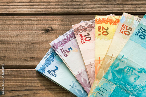 Brazilian money on a wooden background photo