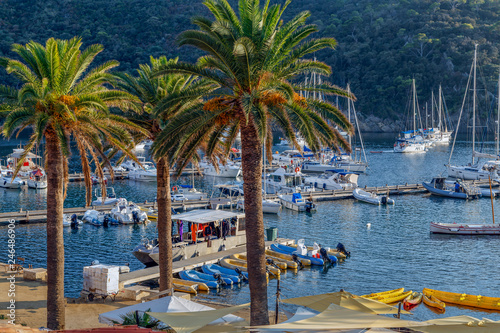 Yachts and boats in the harbor at sunset, reflection, beautiful coastal view, French Riviera. Holidays in France. photo