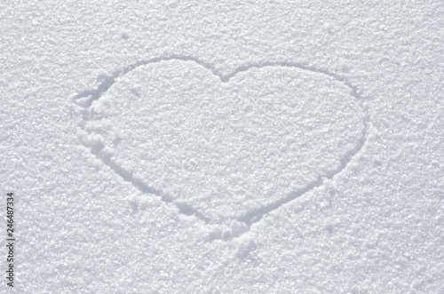 Heart drawn on snow, valentines day concept