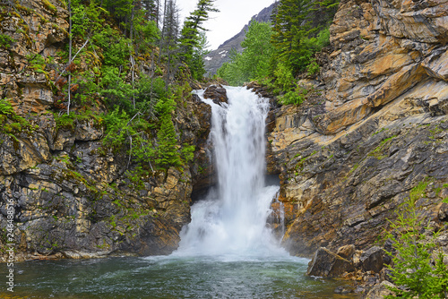 Running Eagle Falls in the Valley of Two Medicine Lake in Glacier National Park. Park is a World Heritage sites and located in the U.S. state of Montana, on the Canada–United States border photo