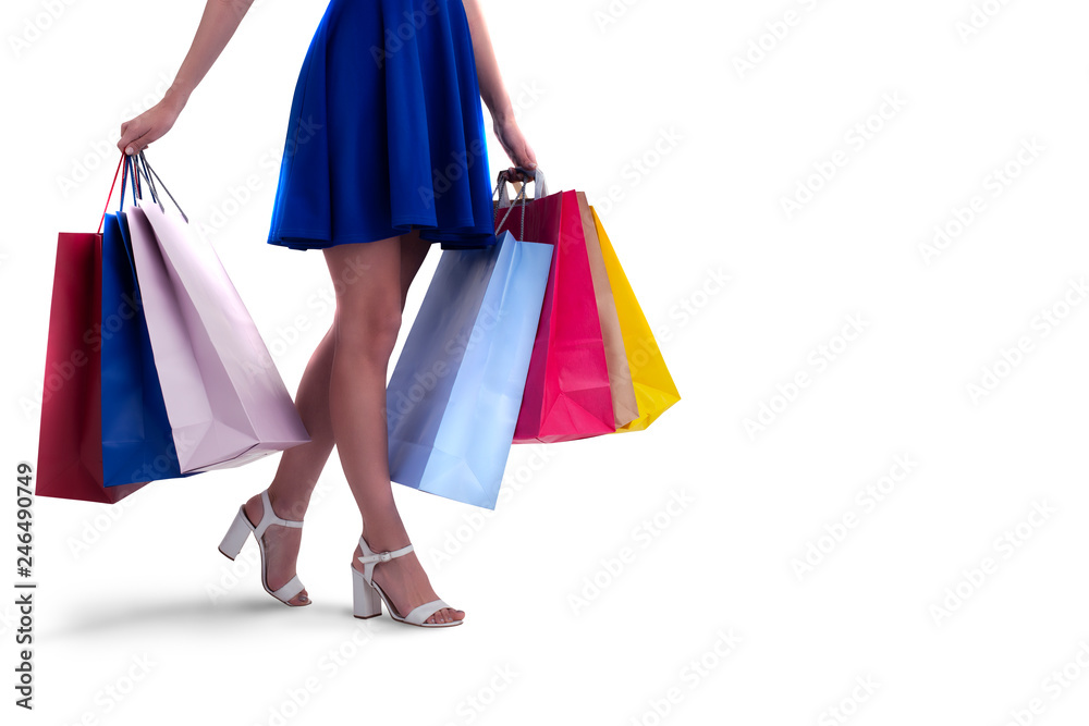 Woman with shopping bags in hand. Isolated on white background