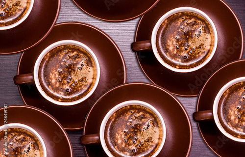 A cup of delicious coffee on a dark background