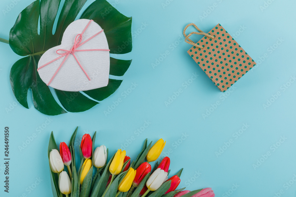 Fototapeta Spring tulips frame on background, top view.