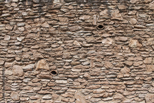 ancient wall with stone bricks photo