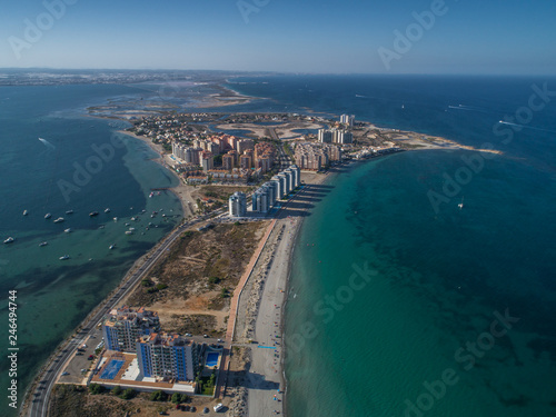 Aerial photo of tall buildings and the beach on a natural spit of La Manga between the Mediterranean and the Mar Menor, Cartagena, Costa Blanca, Spain 15