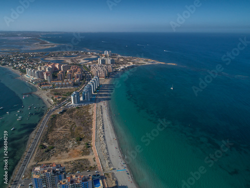 Aerial photo of tall buildings and the beach on a natural spit of La Manga between the Mediterranean and the Mar Menor, Cartagena, Costa Blanca, Spain 16