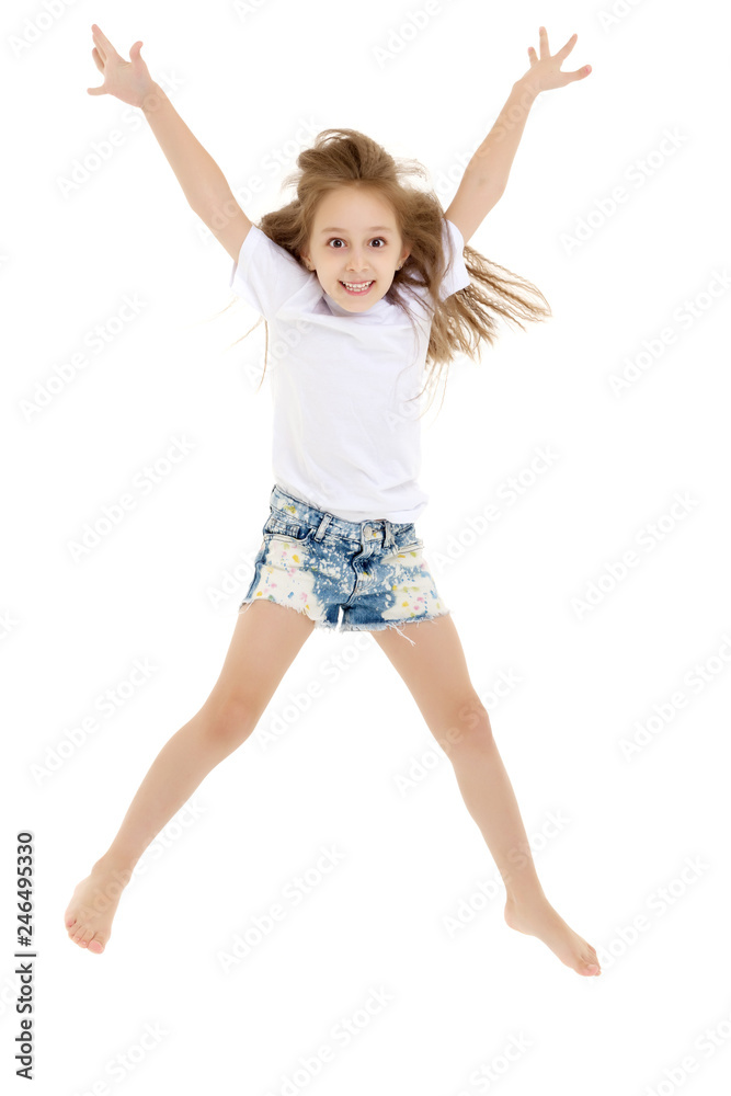 A little girl in a pure white t-shirt is jumping. The concept of A little girl in a pure white t-shirt is jumping. The concept of