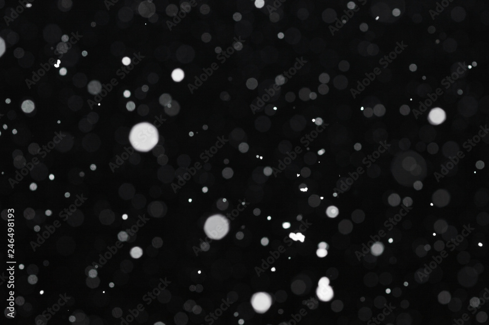 Snow bokeh texture on black background - obrazy, fototapety, plakaty 