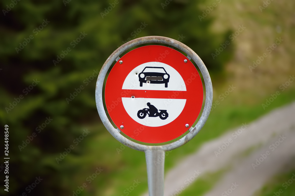 Road sign prohibiting access to cars and motorbikes on walk trail Road sign prohibiting access to cars and motorbikes on walk trail
