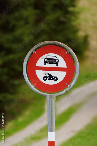 Road sign prohibiting access to cars and motorbikes on walk trail