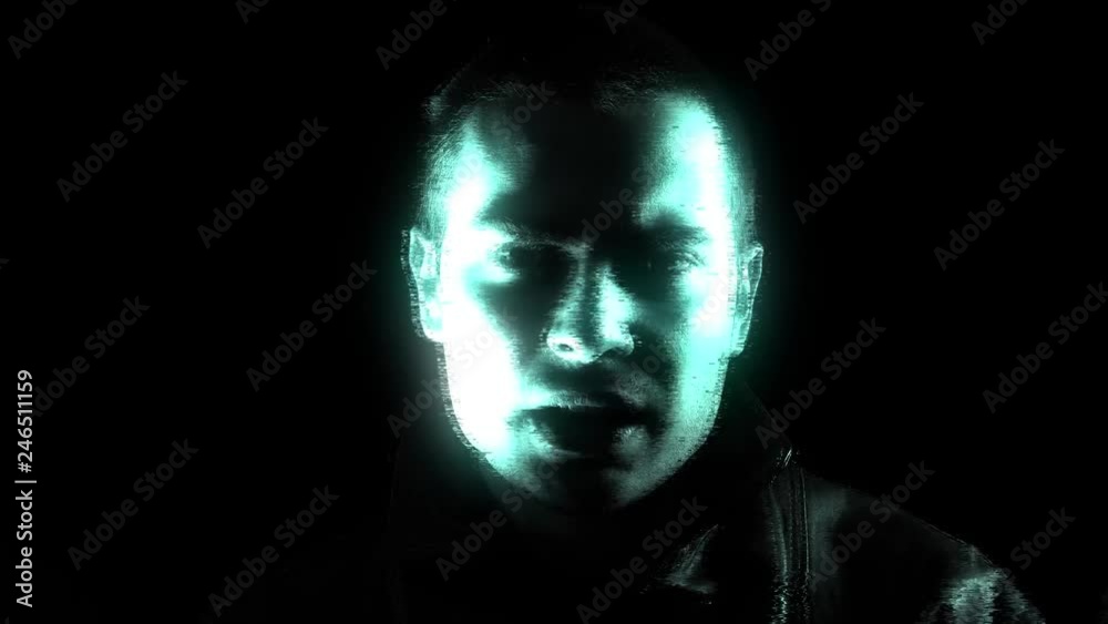 A green hologram of a man talking seriously to the camera. Black background. A green hologram of a man talking seriously to the camera. Black background.