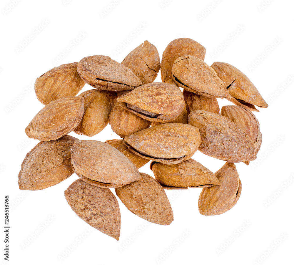 Heap of fresh unpeeled almonds isolated on white background Heap of fresh unpeeled almonds isolated on white background