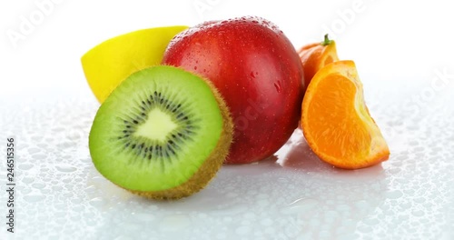 rotating fresh fruits isolated on white background