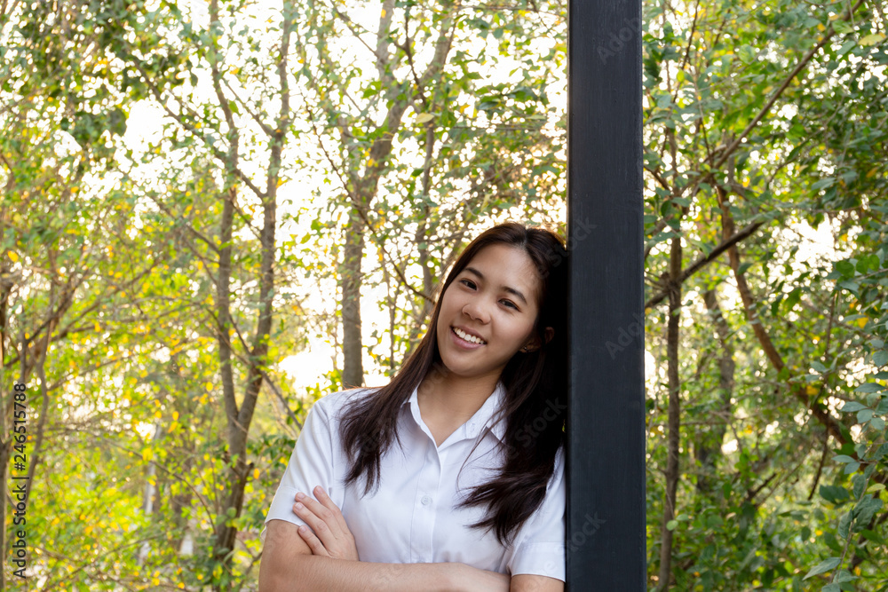Young collage woman smiling with arms folded with nauter sunlight. Young collage woman smiling with arms folded with nauter sunlight.