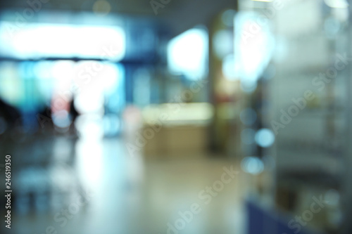Blurred view of modern shopping mall interior © New Africa